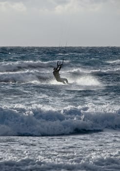 Golden Bay, Malta - 30 Jan 2010 - Man enjoying kite surfing at Golden Bay in Malta