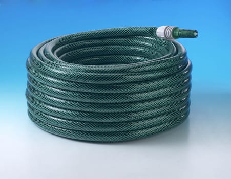 Close-up of green conventional hose pipe 