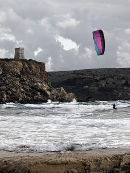 Golden Bay, Malta - 30 Jan 2010 - Man enjoying kite surfing at Golden Bay in Malta