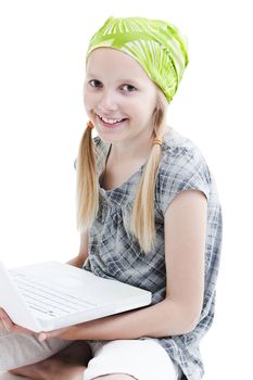 Young girl using a laptop computer over white background