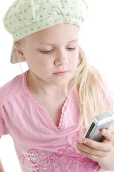 Young girl sending SMS message with her mobile phone
