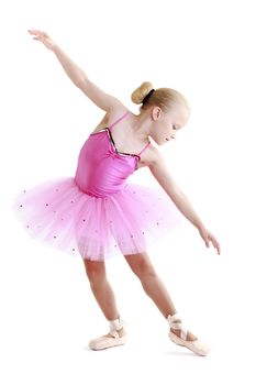 Young ballerina dancer over a white background