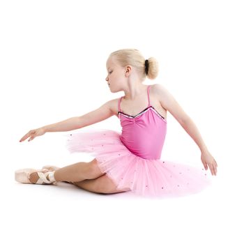 Young ballerina dancer over a white background