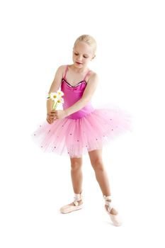 Young ballerina dancer over a white background