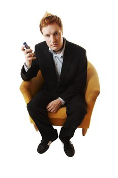 Business man on the couch with mobile phone