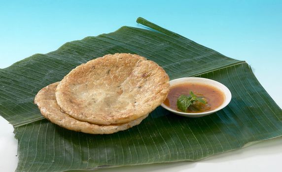 Indian food on banana leaf.