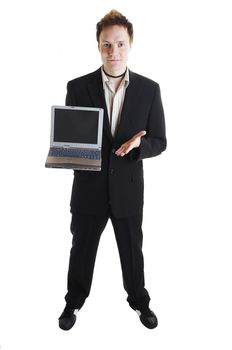 Salesman offering laptop computer to customer