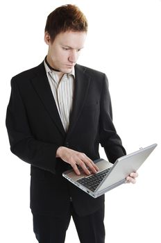 Isolated business man with laptop computer