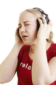 Isolated young woman listening music on earphones and sining along