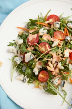 Delicious fresh salad with rocket, pinenuts and blue cheese