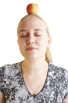 Girl meditating apple over her head