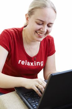 Girl using a laptop computer on white background