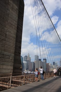 Lower Manhattan and tourists as seen from the Brooklyn Bridge