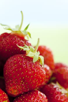 Close up of strawberries over light background