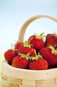 Close up of wooden basket full of strawberries