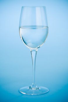 Wine glass filled with crystal clear water