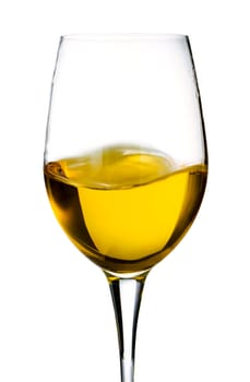 Glass of white wine over a light background