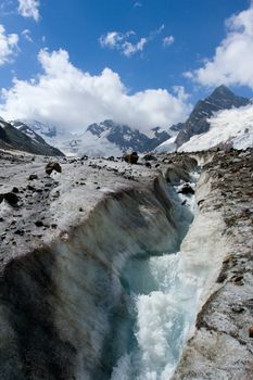 River on glacier in Caucasus mountains