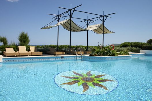 swimming pool and sunshade in resort