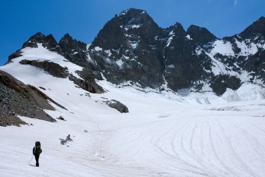 Alpinists  on glacier in Caucasus mountains