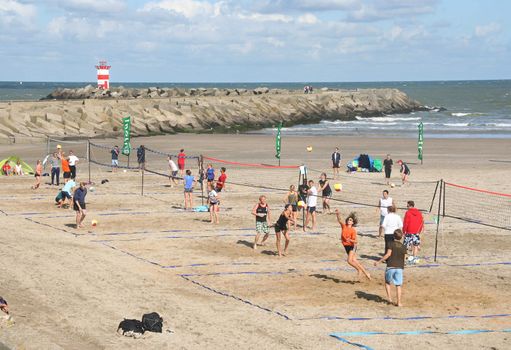 SCHEVENINGEN, HOLLAND - AUGUST 30, 2008: Teams playing in the Dutch championship beach volleybal in Scheveningen on August 30, 2008