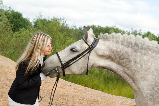 girl with horse.Friendship of an animal and the person