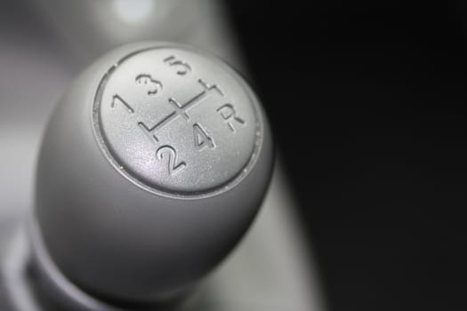 detail of a car interior, stick shift car