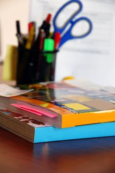 two dense catalogs with bookmarks closeup on office desk
