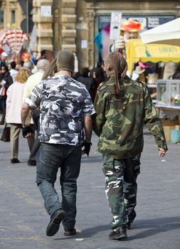 Two robbers with stockings on their faces roaming the streets