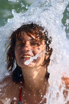 girl in bikini under the sea wave