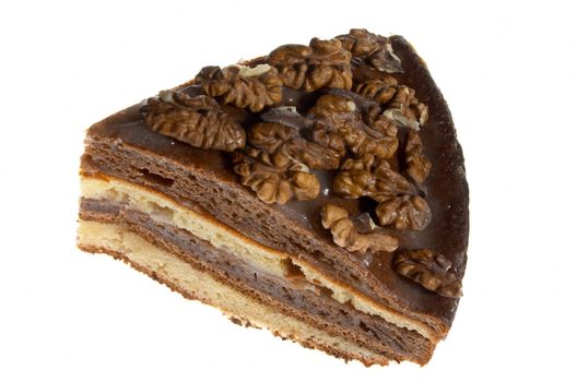 Piece of cake decorated with walnuts