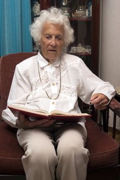 portrait of senior woman reading the bible