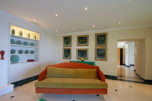 modern interior of sitting-room with orange sofa