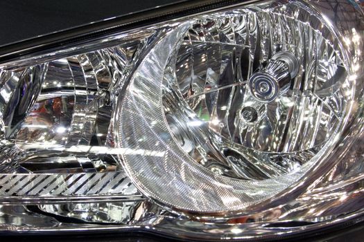 Close-up of a new modern car head lamp