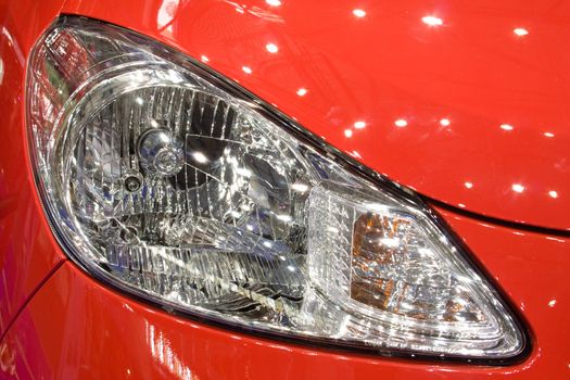 Close-up of a new modern car head lamp