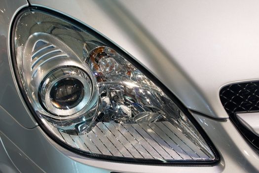 Close-up of a new modern car head lamp