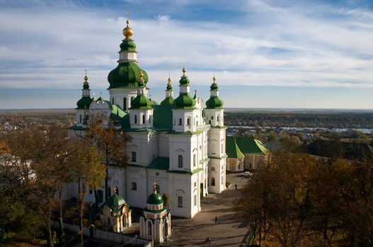 Protestant Christianity cathedral with green cupola under blue sky