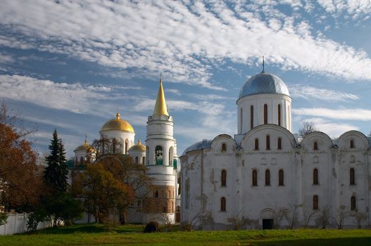 old Christianity churches under blue sky with clouds