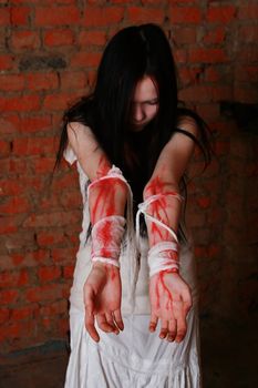 The girl with the stained blood hands in white clothes