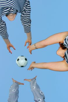 Three friends cheerfully play on the nature