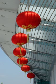 Red lantern, typical Chinese decoration for New Year in front of office buidling in Shanghai city.