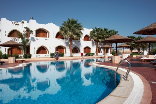 blue swimming pool in mediterranean resort