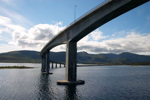 curved bridge over sea fiord in norway