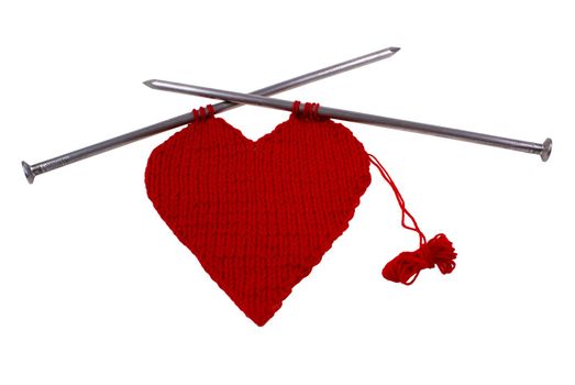 woollen heart made on wires isolated on white background