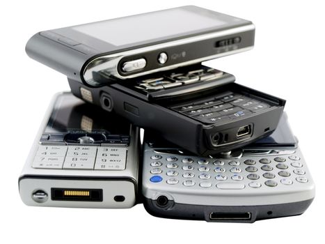 Stack of Several Modern Mobile Phones on White