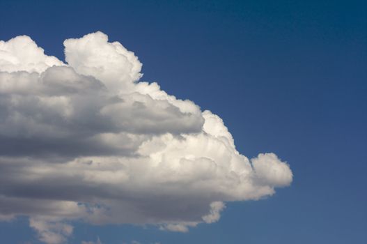 Puffy Storm Clouds Forming on a blue sky.