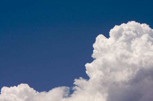 Puffy Storm Clouds Forming on a blue sky.