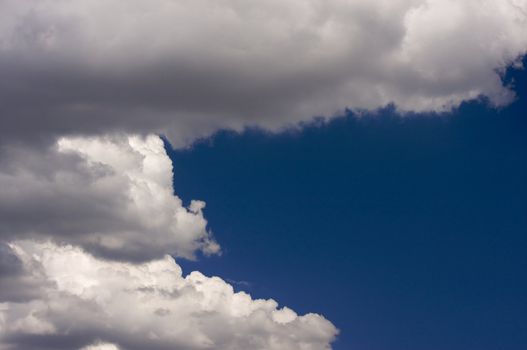 Puffy Storm Clouds Forming on a blue sky.
