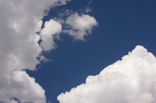 Puffy Storm Clouds Forming on a blue sky.