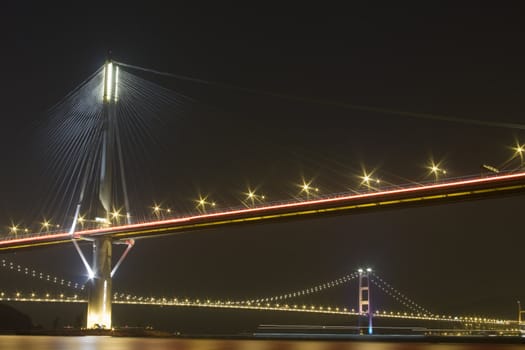 It is beautiful night scenes of Bridge in Hong Kong.